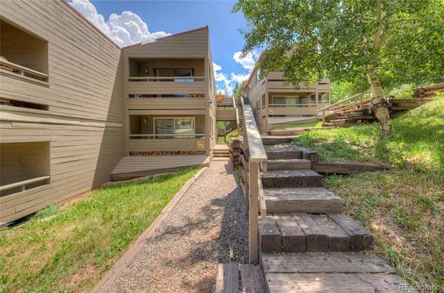 view of yard featuring stairway