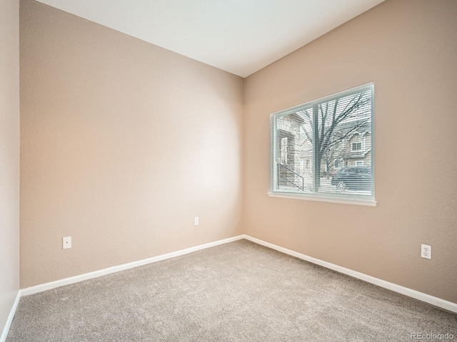 unfurnished room featuring carpet flooring