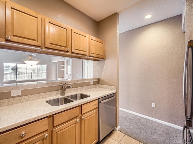 kitchen featuring sink, stainless steel dishwasher, and light tile patterned floors