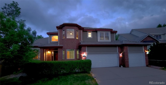 518 Zircon Way, Superior, CO 80027 - view of front facade with brick siding, driveway, and an attached garage