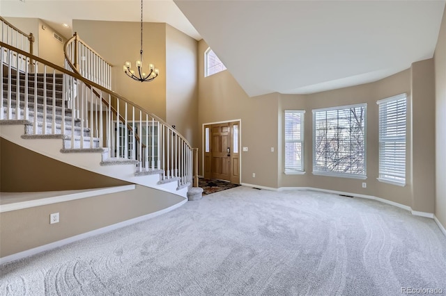 518 Zircon Way, Superior, CO 80027 - foyer entrance featuring healthy amount of natural light, carpet, a chandelier, baseboards, and high vaulted ceiling