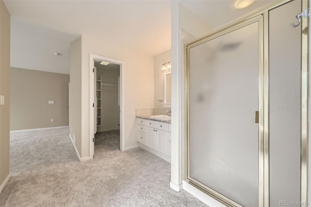 518 Zircon Way, Superior, CO 80027 - full bathroom with vanity, a shower stall, carpet, baseboards, and a walk in closet