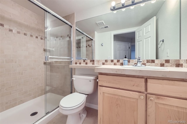 518 Zircon Way, Superior, CO 80027 - bathroom with toilet, vanity, a stall shower, and tile patterned flooring