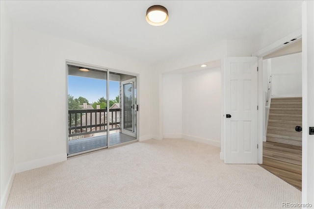 3413 W 114th Cir Unit B, Westminster, CO 80031 - carpeted spare room featuring baseboards and stairs