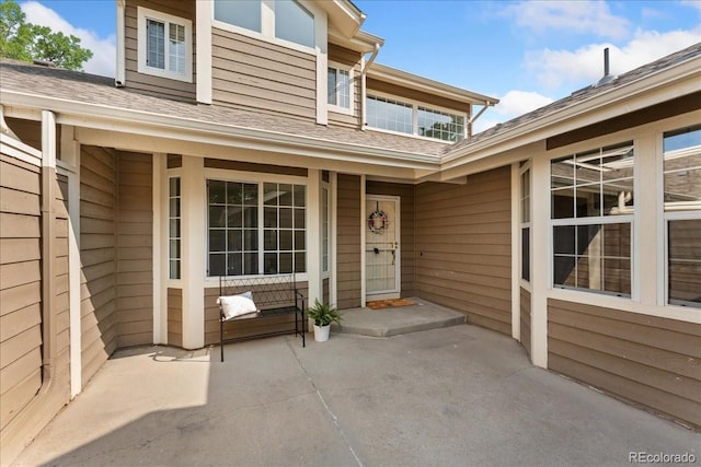 3413 W 114th Cir Unit B, Westminster, CO 80031 - view of exterior entry with roof with shingles and covered porch