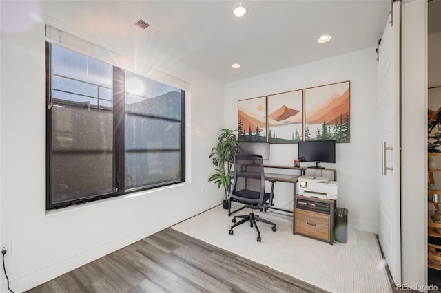 office area with baseboards, wood finished floors, visible vents, and recessed lighting