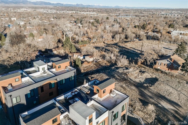 aerial view featuring a residential view, view of desert, and a mountain view