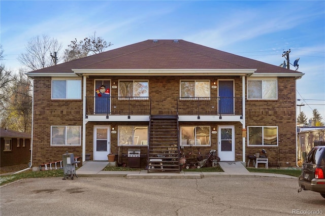 multi unit property featuring a balcony