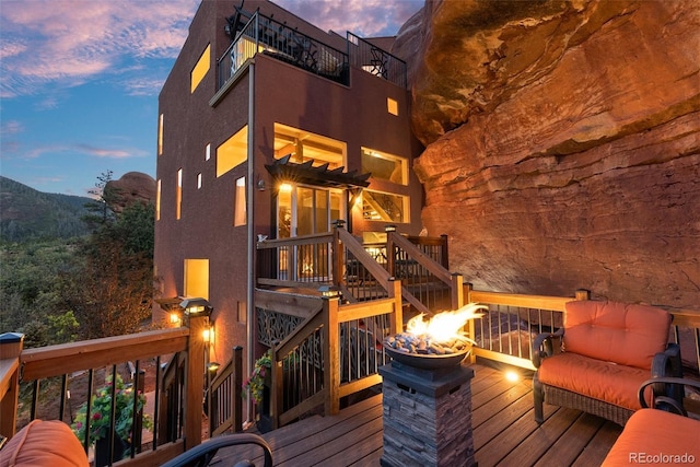6619 Apache Pl, Larkspur, CO 80118 - view of deck at dusk