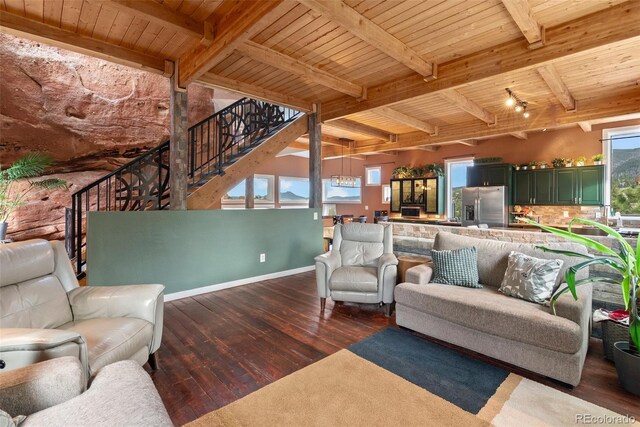 6619 Apache Pl, Larkspur, CO 80118 - living room featuring wood-type flooring, stairs, wood ceiling with exposed beams, and baseboards