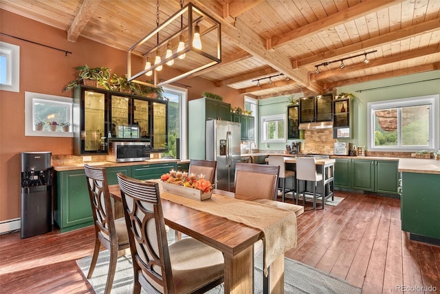 6619 Apache Pl, Larkspur, CO 80118 - dining area with wood ceiling with exposed beams, wood-type flooring, and a baseboard heating unit