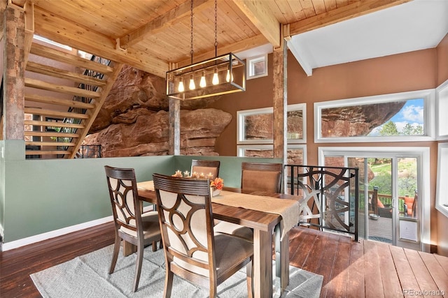 6619 Apache Pl, Larkspur, CO 80118 - dining room with wooden ceiling with exposed beams, hardwood / wood-style flooring, and baseboards