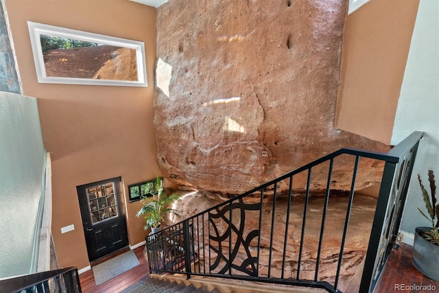 6619 Apache Pl, Larkspur, CO 80118 - stairs featuring wood finished floors and baseboards