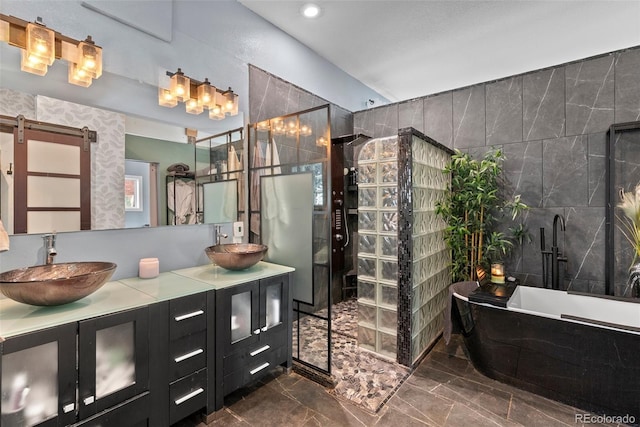 6619 Apache Pl, Larkspur, CO 80118 - full bathroom featuring tile walls, marble finish flooring, a freestanding bath, double vanity, and a tile shower