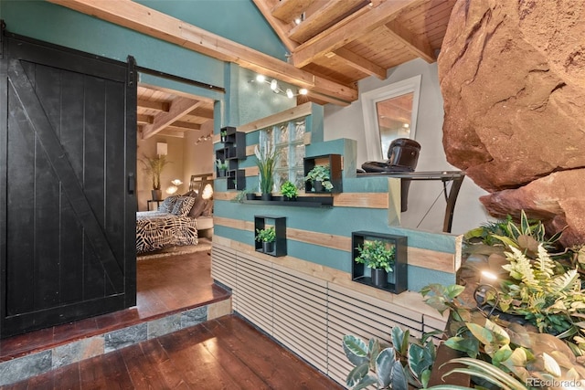 6619 Apache Pl, Larkspur, CO 80118 - welcome area with wood ceiling with exposed beams and a barn door