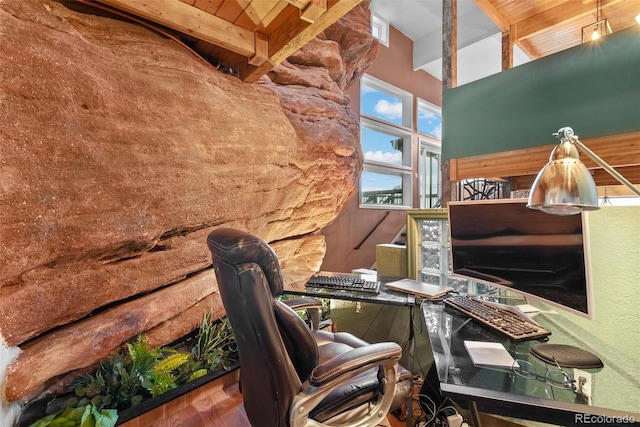6619 Apache Pl, Larkspur, CO 80118 - office area with wood ceiling with exposed beams, a towering ceiling, and wood finished floors