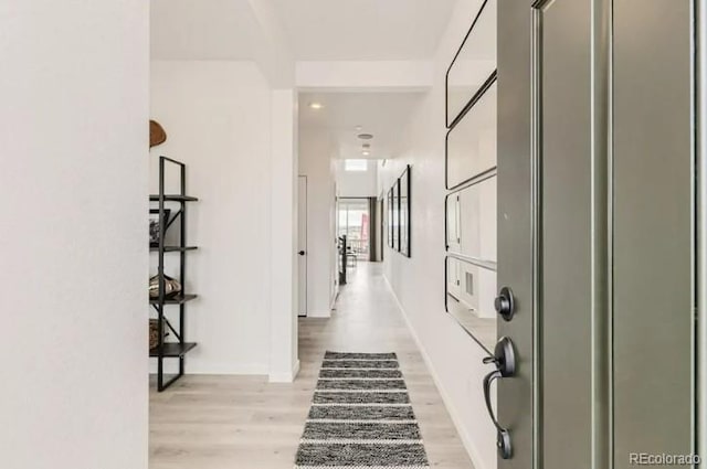 16947 W 92nd Dr, Arvada, CO 80007 - hallway with light wood-type flooring and baseboards