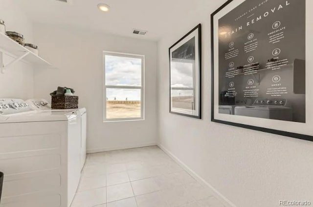 16947 W 92nd Dr, Arvada, CO 80007 - laundry room featuring independent washer and dryer, tile patterned floors, and baseboards