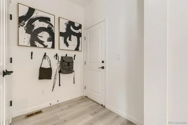 16947 W 92nd Dr, Arvada, CO 80007 - mudroom with light wood-style floors and baseboards