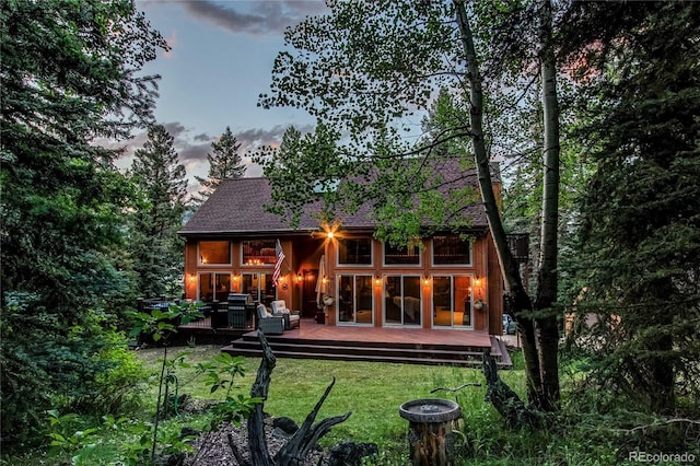 25257 Snyder Ave, Conifer, CO 80433 - rear view of house with a yard and a deck