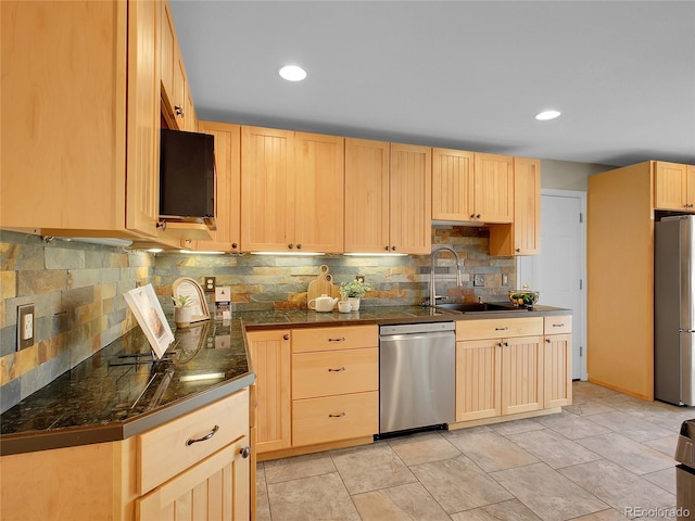 312 Allen St, Golden, CO 80401 - kitchen with stainless steel appliances, light brown cabinetry, backsplash, and recessed lighting