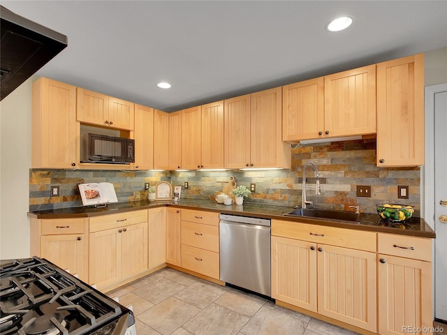 312 Allen St, Golden, CO 80401 - kitchen with stainless steel dishwasher, black microwave, light brown cabinetry, dark countertops, and decorative backsplash