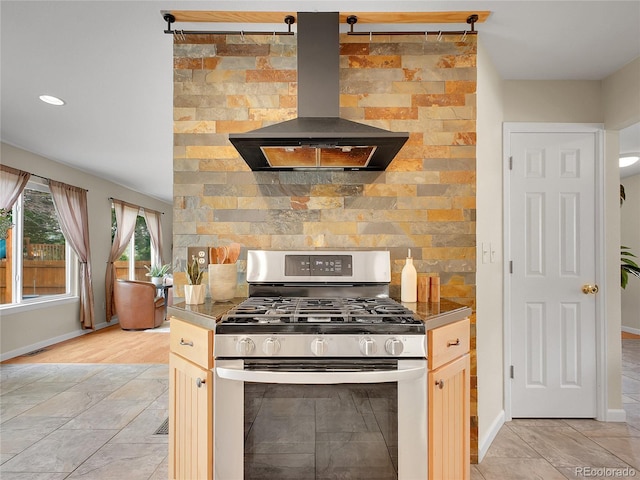 312 Allen St, Golden, CO 80401 - kitchen with stainless steel gas range, island exhaust hood, decorative backsplash, and recessed lighting