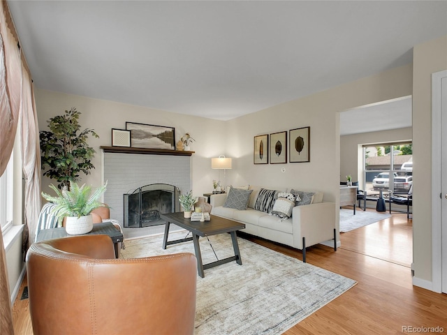 312 Allen St, Golden, CO 80401 - living area with a brick fireplace and wood finished floors