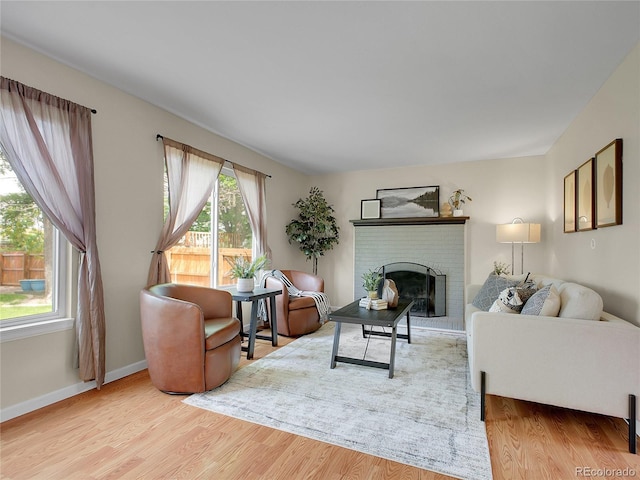 312 Allen St, Golden, CO 80401 - living area with wood finished floors and a brick fireplace