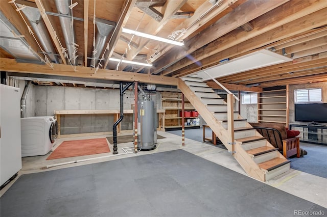 312 Allen St, Golden, CO 80401 - basement featuring washer / clothes dryer, water heater, stairs, and freestanding refrigerator