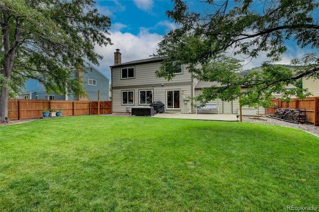 312 Allen St, Golden, CO 80401 - rear view of property featuring a patio area, a fenced backyard, and a chimney