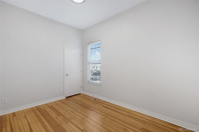 empty room featuring hardwood / wood-style floors