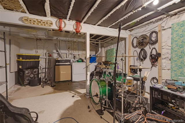 basement featuring a workshop area and washer / clothes dryer