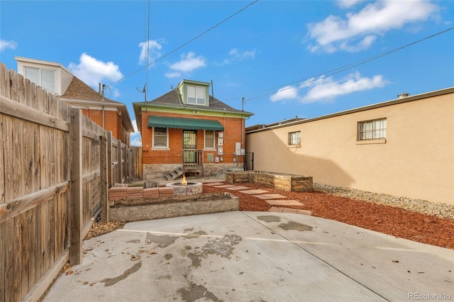 back of property featuring a patio area