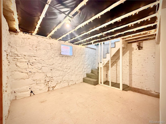 unfinished basement with stairway