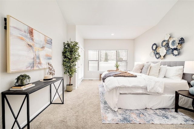 bedroom featuring light colored carpet