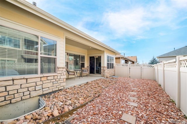 back of property featuring a patio