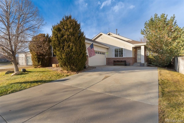 view of front of house with a garage and a front lawn