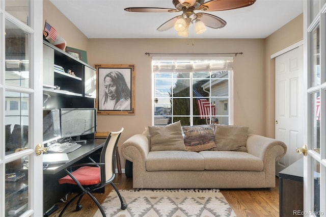 office space featuring hardwood / wood-style flooring and ceiling fan