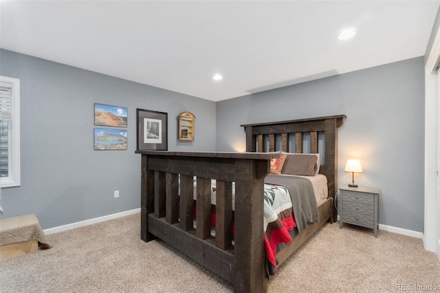 bedroom featuring light carpet