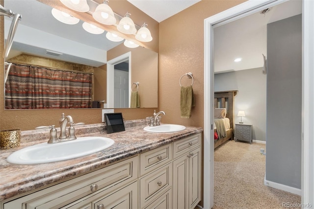 bathroom with vanity and walk in shower