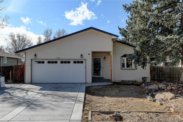 single story home featuring driveway, an attached garage, and fence