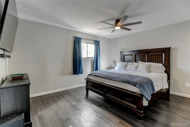 bedroom with ceiling fan, baseboards, and wood finished floors