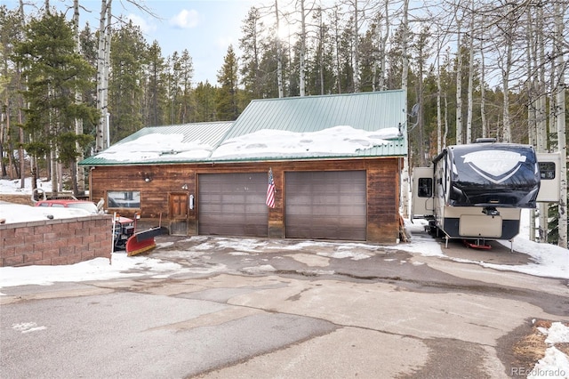 view of snow covered garage