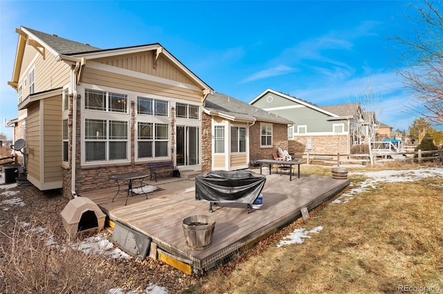 rear view of property with a wooden deck