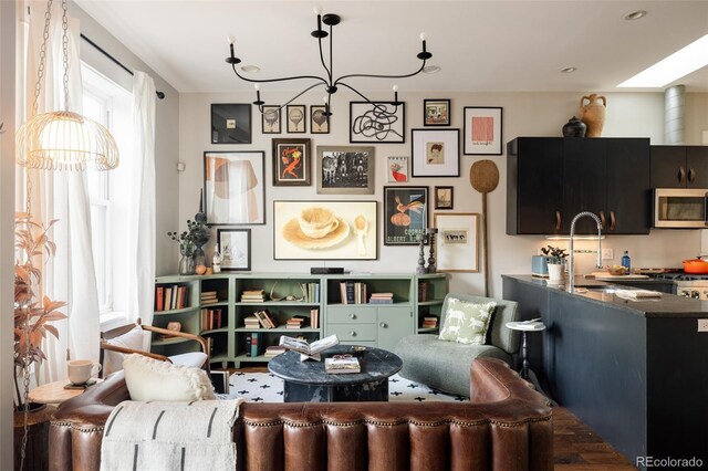 living room featuring an inviting chandelier