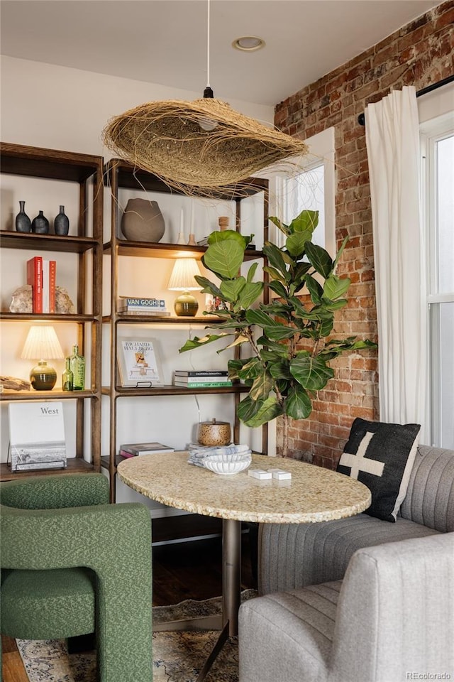 interior space with a wealth of natural light and brick wall