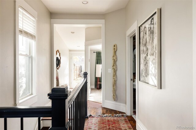 hallway with wood-type flooring