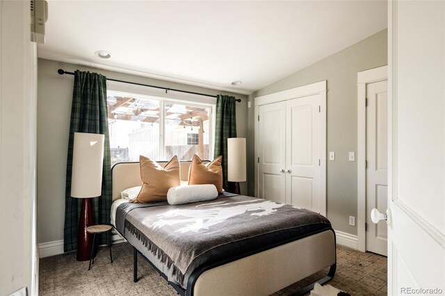 bedroom with a closet and lofted ceiling