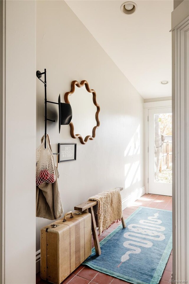 tiled bedroom with lofted ceiling